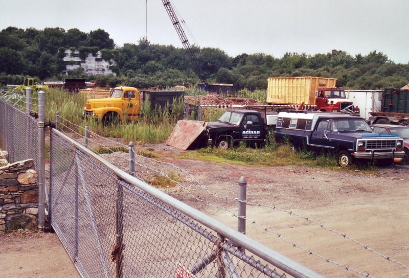 Road work machinery and other vehicles stored now on the site
