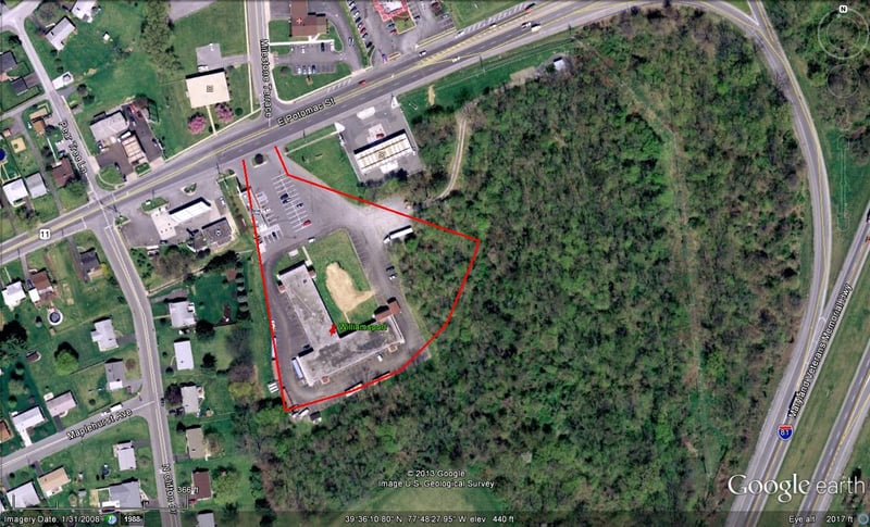 Google Earth image with former site outlined