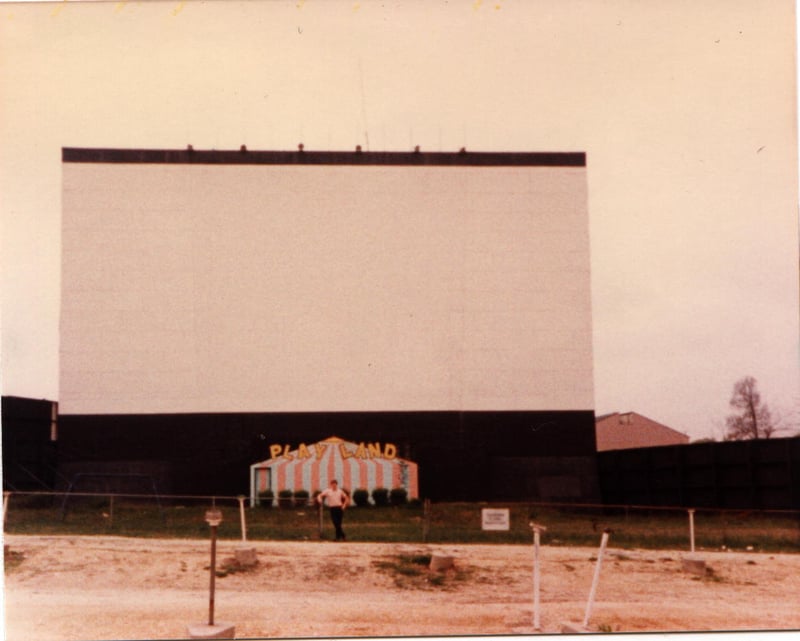 Third-row POV.  The once-thriving PlayLand was now reduced to a single rusty swing set (far left). 

