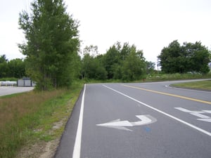 former entrance road, now paved over.