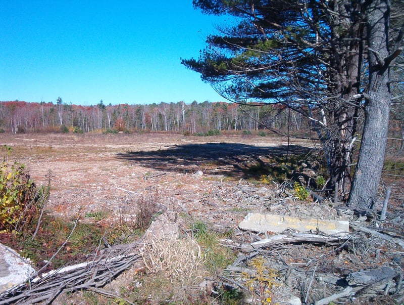 Old ticket booth foundation and the field full of ramps.