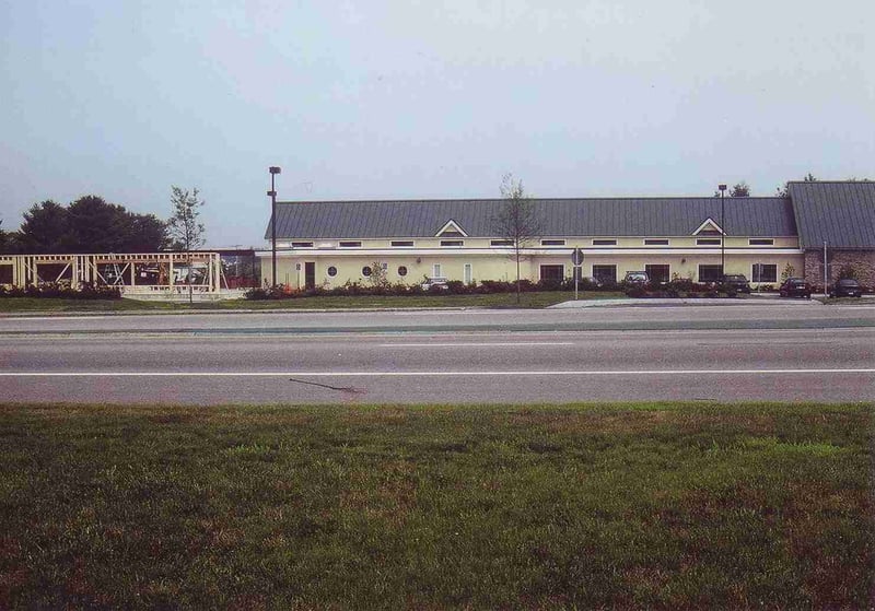 The unfinished structure of the car wash can be seen at the left