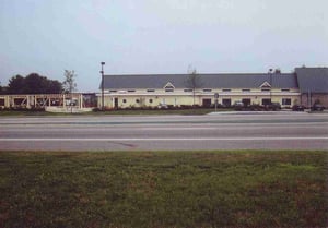 The unfinished structure of the car wash can be seen at the left