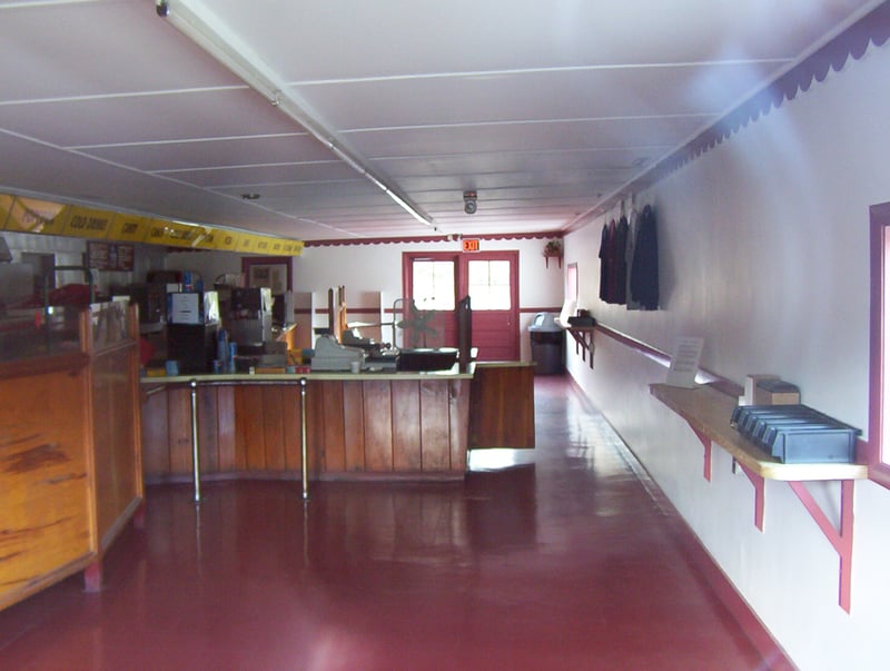 Photo (through glass) of the suprisingly clean concession area at the Saco Drive-In.