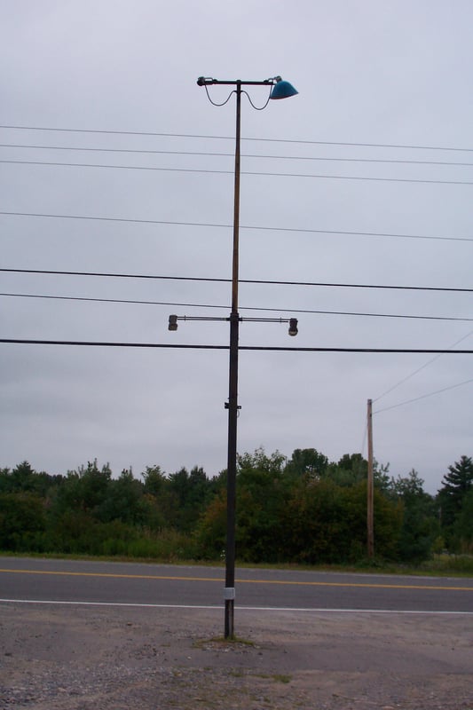 Ligh tower that used to hold the sign.