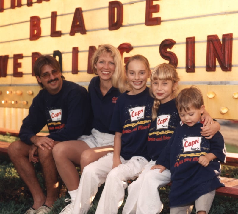 Owners Tom and Sue Magocs with their family in front of the marquee