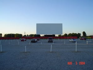 This is the screen 1 lot with my brown '89 Eagle Premier towards the left. Notice the speaker poles. They redid them so only one car can park between two poles now.