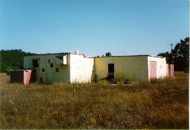 The thoroughly wrecked snack bar still remains.