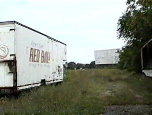 Douglas screen and abandoned moving vans