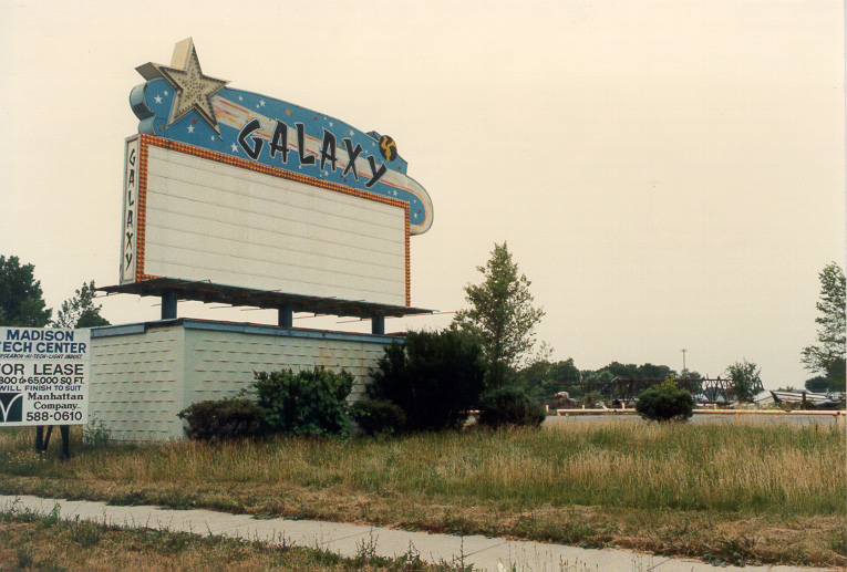 A color photo of the marquee with demolished screen in the background. Back of photo read Galaxy Demolition 1987 Thanks to Jean Sterrit of Madison Heights Historical Society for the use of this photo. Photographer unknown.