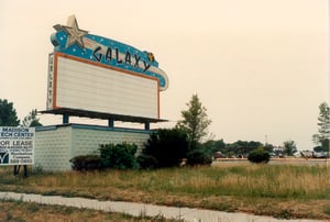 A color photo of the marquee with demolished screen in the background. Back of photo read Galaxy Demolition 1987 Thanks to Jean Sterrit of Madison Heights Historical Society for the use of this photo. Photographer unknown.
