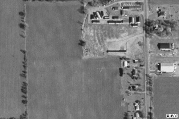 Terraserver aerial view of remnants. Ramps remain on about half the former field that wasn't taken by the mobile home dealer