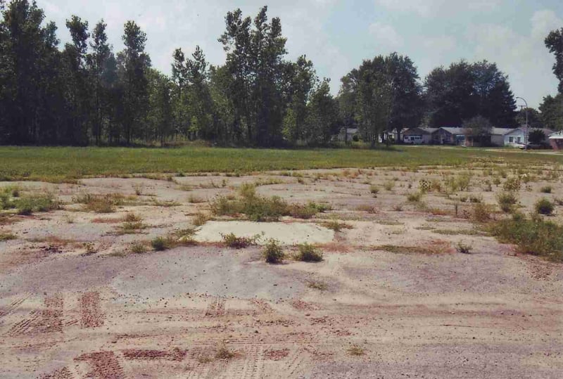 In the middle of the entrance road the concrete slab of the ticket booth still remains