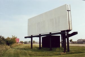 Empty marquee with red screen in background