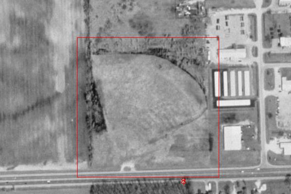 TerraServer image.  Faint footprint with ramp remains and driveway.