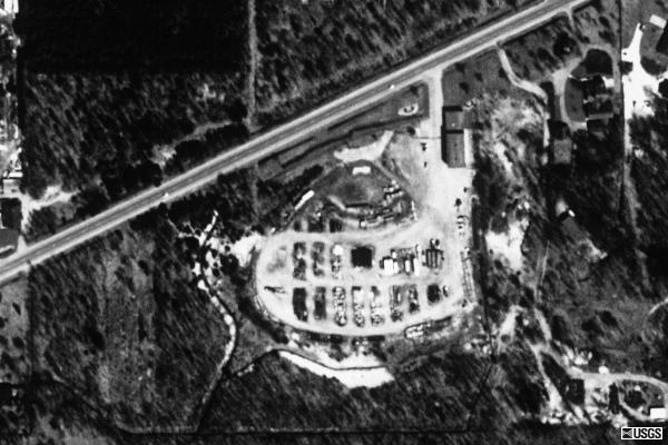 Terraserver aerial photo showing remnants of drive-in. Looks to be used for other use now. Many ramps, and what appears to be the screentower is still there as of 97.