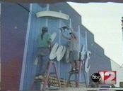 2002 installation of old Twilite sign on the outer wall of the store The Listening Room, just across the street.