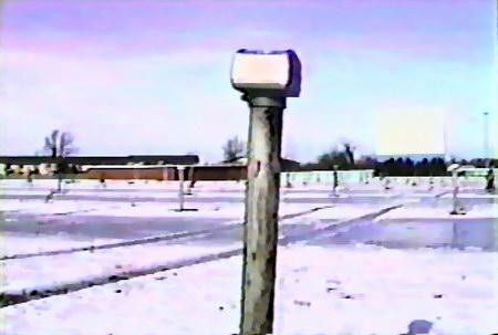 lot, speaker poles, and projection/concession building(seen on the left of the pole) (also from Darryl Burgess + W. Winter Wonderland)