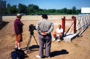 A crew from a Detroit-area cable TV program interviews U.S. 23 Twin Drive-In owner Lou Warrington.