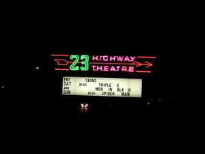 Restored Marquee with neon flashing arrows lit up.