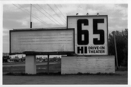This was taken the day the theater's destruction began. I had been there a week prior and everything had been intact, but when I returned with the camera the place had been spraypainted and bulldozed. I took half a roll of film of the marquee before act