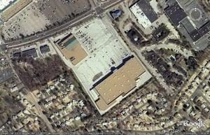 Aerial view of former drive-in site with shopping center