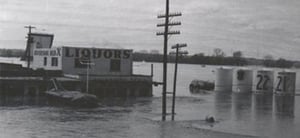 Riverside DI screen in background left side. Taken during 1951 flood. Red X liquors is still there.