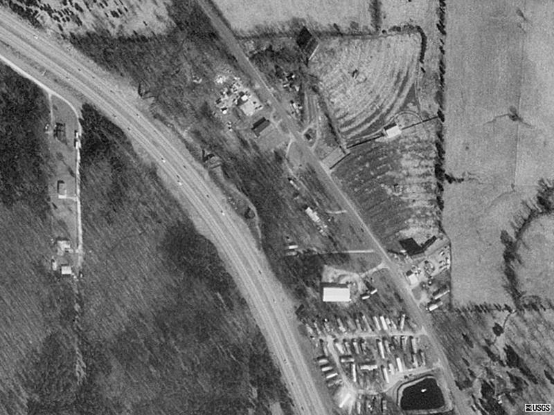 Aerial shot of the drive-inS. Looks like everything is there but abandoned in this pic. Actually, this theatre was situated along old 2-lane 67, now a service road and bypassed by a 4-lane highway to the west. Just north of town, like Bob said.