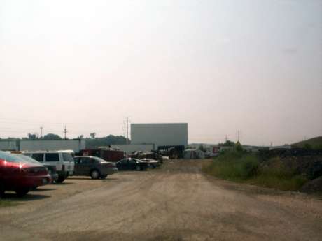 Screen appears( from this distance ) to still be in good shape, lot is used for storage of buses and trailers