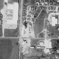 Drive-In long torn down, but you can still see some remnants of the ramps from Terraserver aerial view.