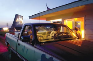 ticket booth and screen just right after the start of a movie, taken opening night 2002 (from Rural Missouri article)