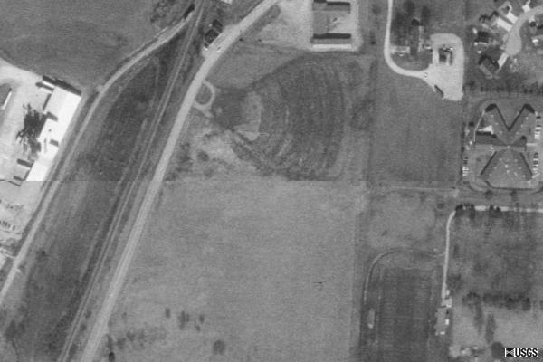 Torn Down. Remnants of Footprint & Ramps still visible from Terraserver aerial view.