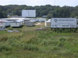 trailer sales business with screen in background