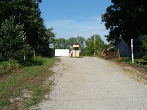 Long shot of entrance path and ticket booth for the Guntown Drive In in Guntown, MS.