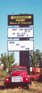 The sign, on the back of the truck, down the way from the drive-in
