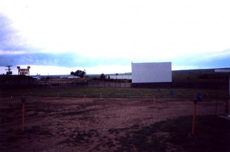 inside lot, screen, + speaker poles