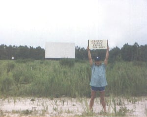 Me with a sign found on property.