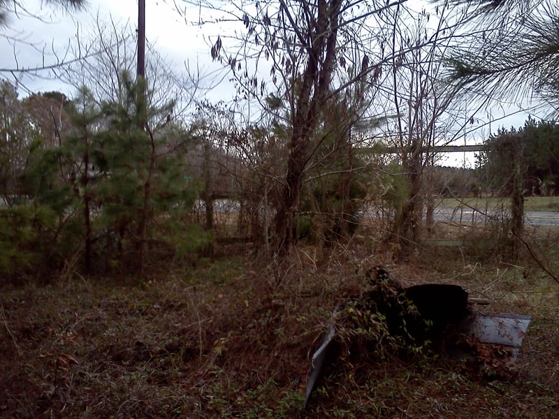 Vacant advertising signs facing the highway maybe