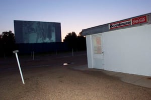 Concessions building, screen, and speaker pole