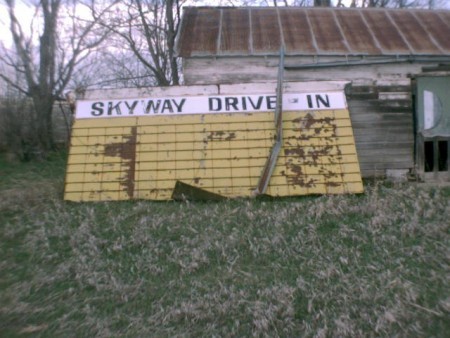 Marquee leaned against outbuilding Skyway Drive In - Schuyler, NE