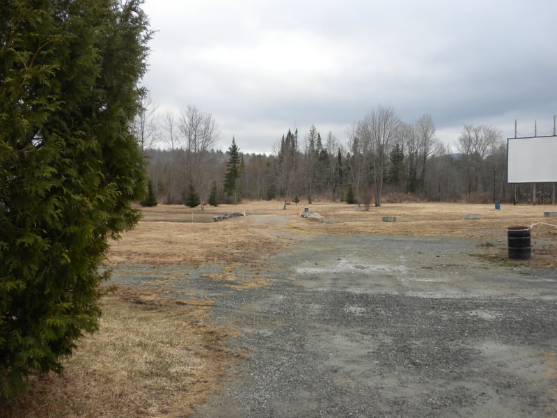 View of field.  There is a small bridge in the middle of the field.