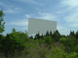 This is all that remains of the Absecon Drive-in in New Jersey. The screen still looks great, you could show movies on it today. No more Consession stand or Booth, it is all over grown.