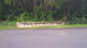 Just a trace of the old drive-in is left. The concrete retaining wall that separated the back of the screen from the creek.