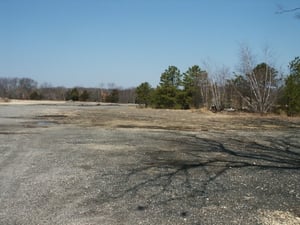 View from where screen was looking west, looking towards Rt. 34 & Harvest Exchange. Original tree & shrub line is to the right where speaker poles were found.
