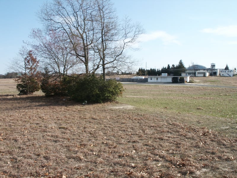 View towards projection building (now a lawn sprinkler contractor) with screen on far left side of picture (screen long gone, but all foundations & support brackets are still easily seen).