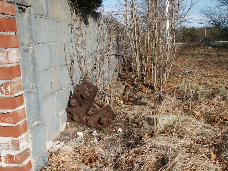 Close-up of rear screen tower foundation support bracket. Some of the original wood of the tower frame work was still in place in the other brackets.