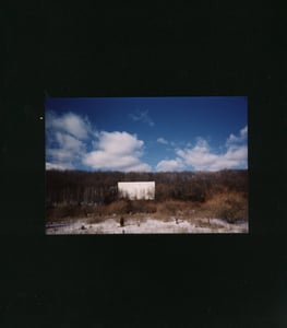 Inside Newton Drive-in very large but hard to tell how big because of trees & bushes over the lot  

