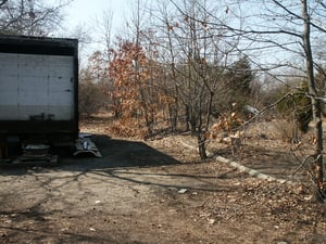 Driveway going towards the ticket booths. Notice curb on right side of picture.