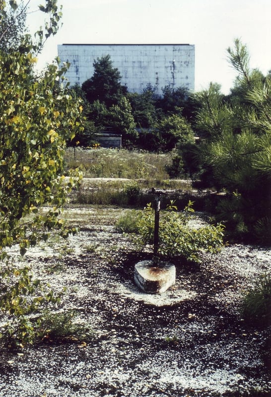 Distant view with a building barely visible
in the woods