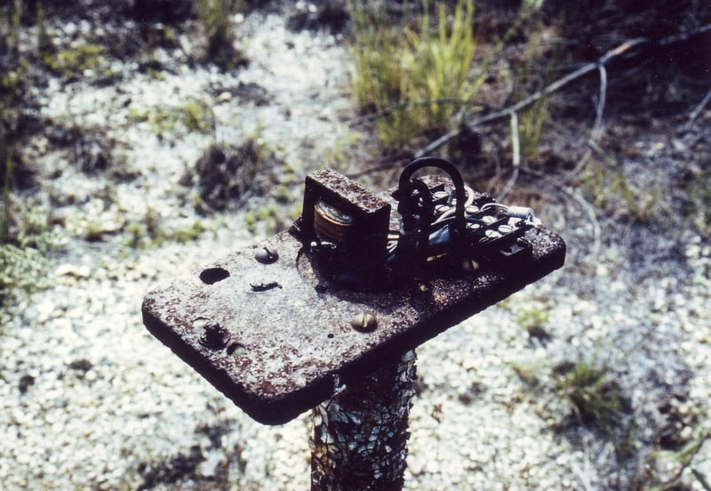 Rusted speaker pole missing its cover